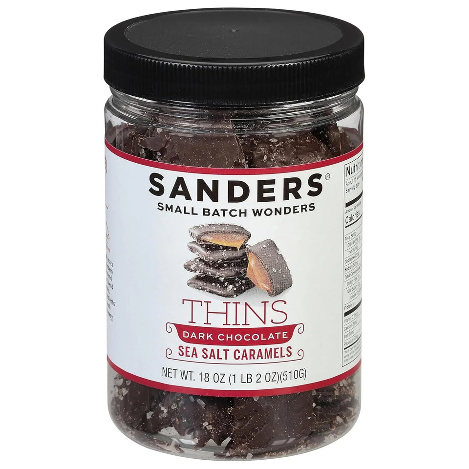 Jar of Sanders Dark Chocolate Sea Salt Caramels with a black lid on a white background