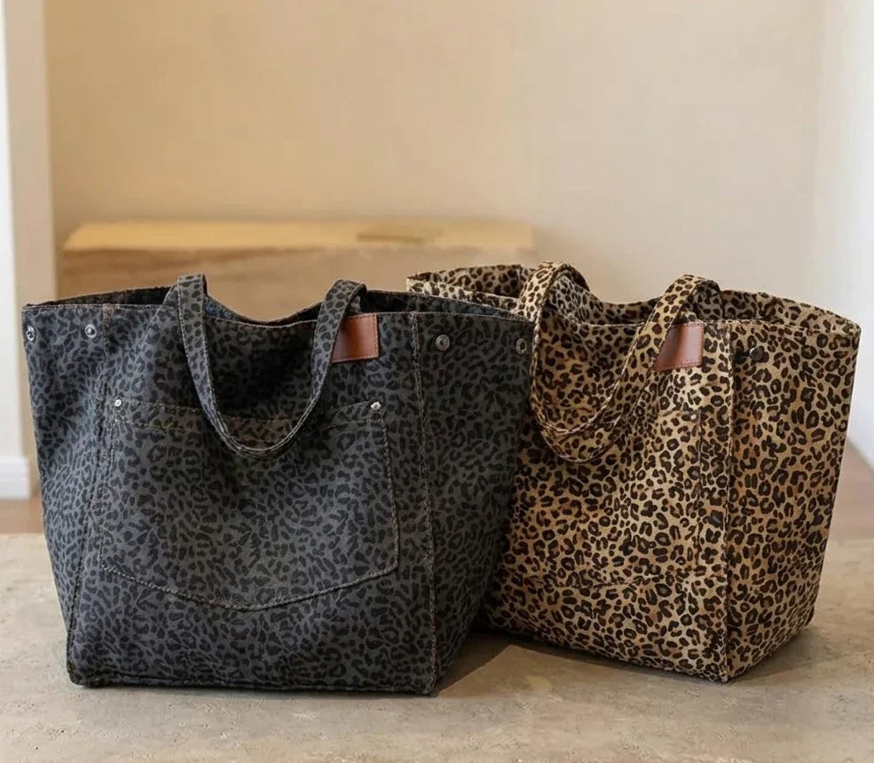 Two tote bags with leopard print pattern on a neutral background