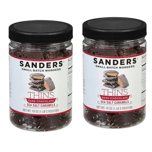 Two jars of Sanders Dark Chocolate Sea Salt Caramels on a white background