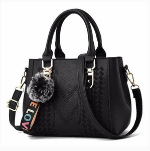 Blue handbag with measurements on a light gray background